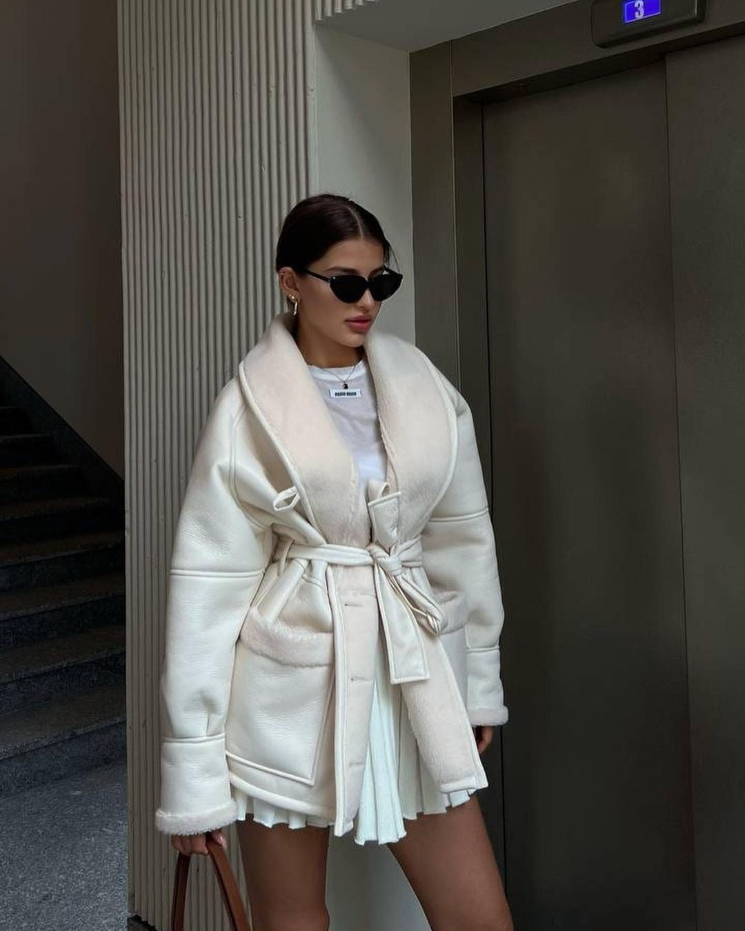 Manteau d'épissage à manches longues en cuir pour femmes